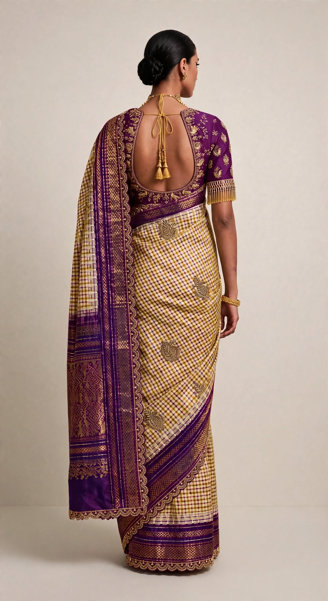 Mustard checks handloom silk saree — back view showing deep backless blouse with tassel tie