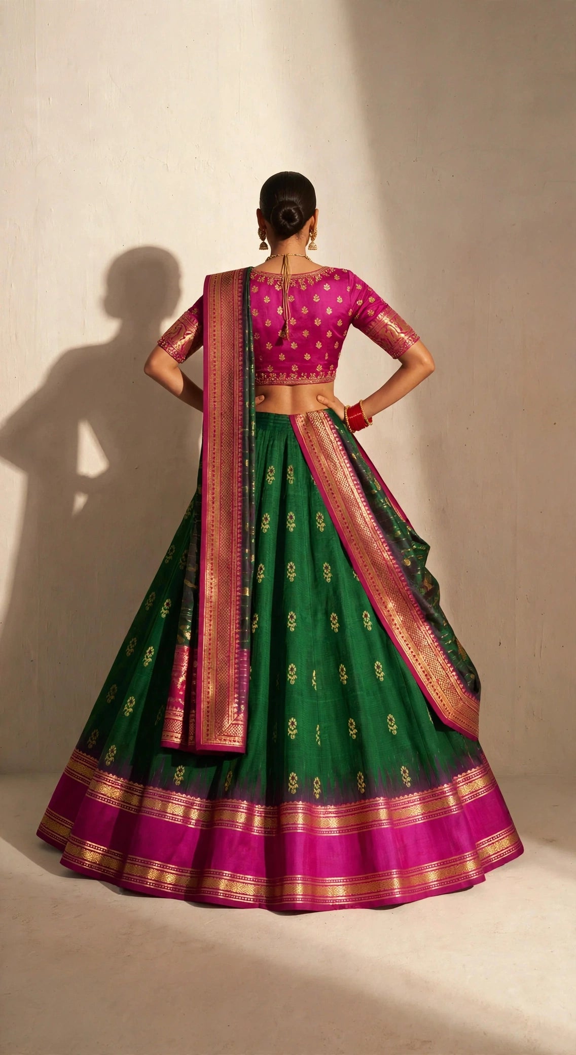 Emerald green Molkalmuru lehenga set - back view showing open back blouse