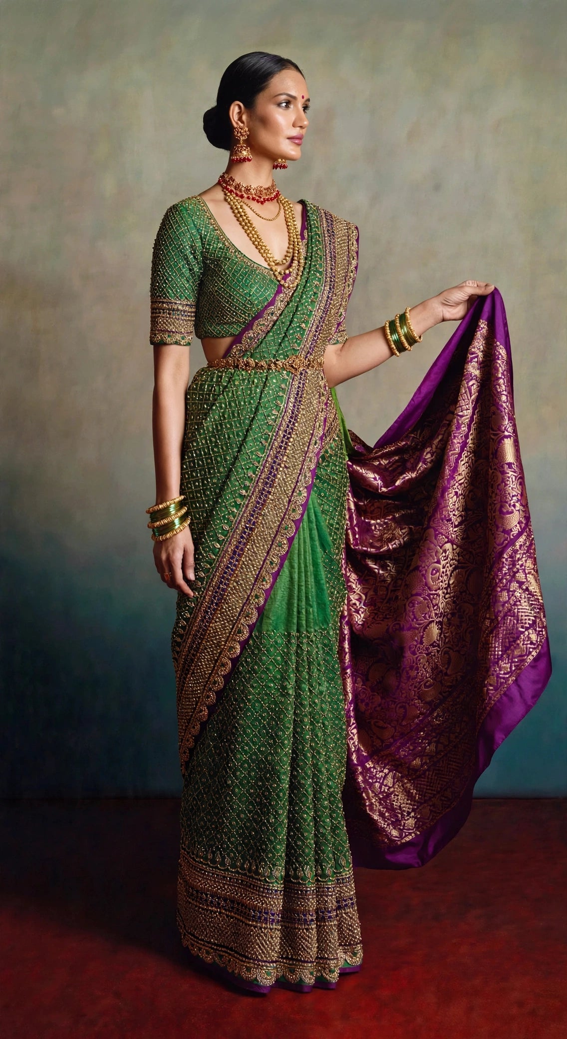Karnataka Rewoven saree — model holding out the Ilkal silk pallu with gold zari brocade